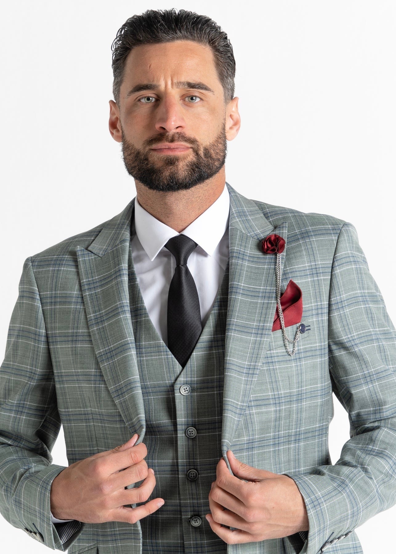 Model wearing Kensington Olive Suit is close to the camera, showing details of upper torso of the suit.