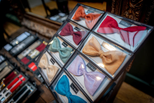 Colourful bow ties and braces.