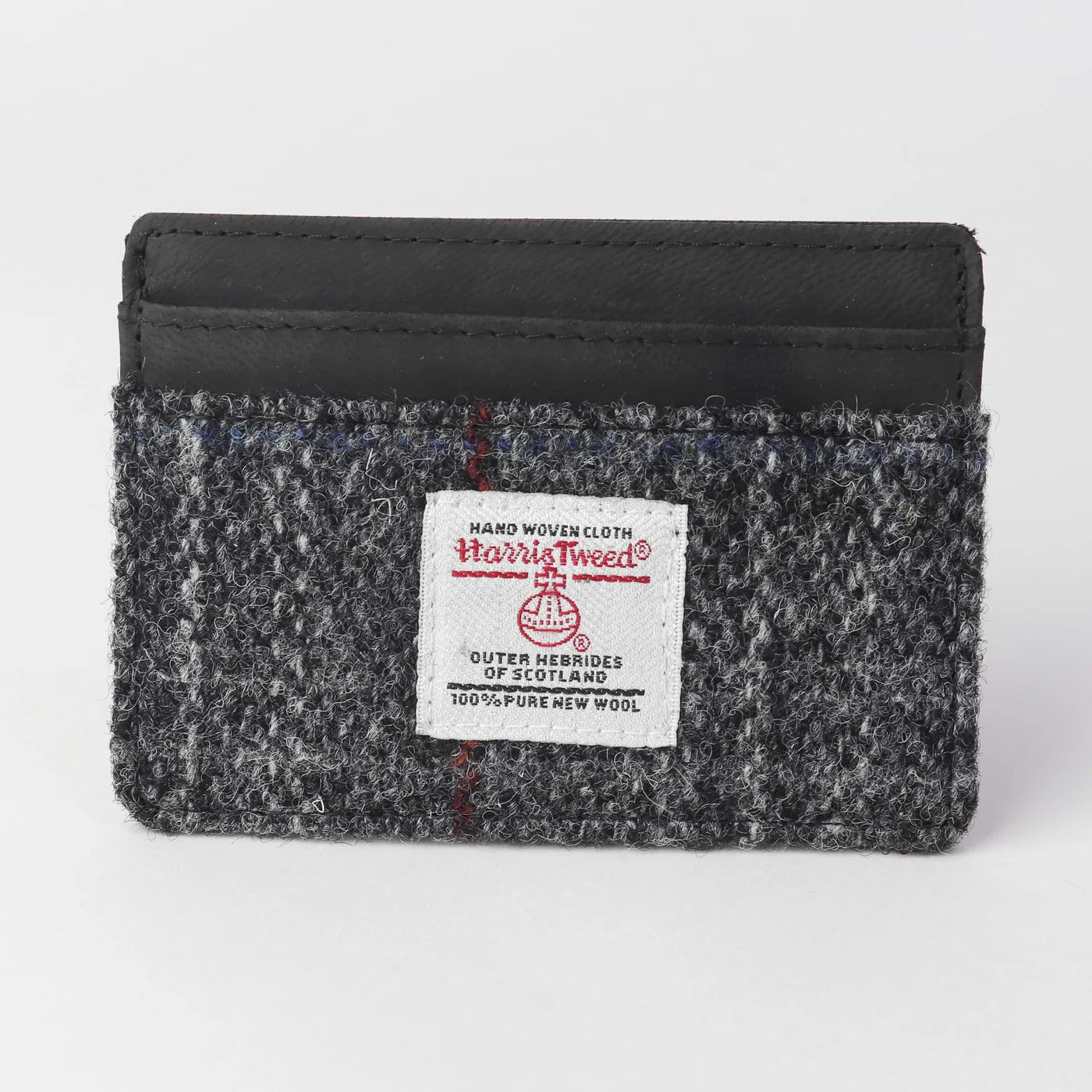 Card holder for men made of tweed.