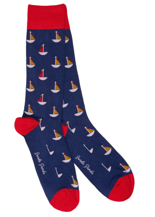 Navy socks with a pattern of sail boats on bamboo socks for men.