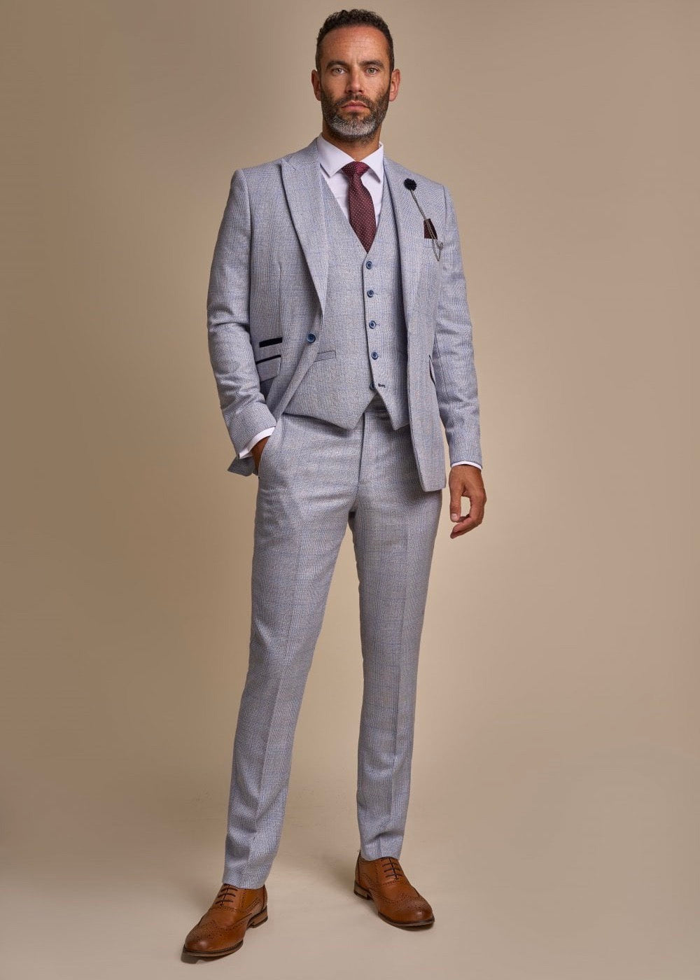 Caridi sky suit for men, showing sky men's suit jacket, sky men's waistcoat, and sky men's suit trousers.