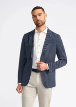 Load image into Gallery viewer, Men&#39;s navy blazer with stripes, worn by model.
