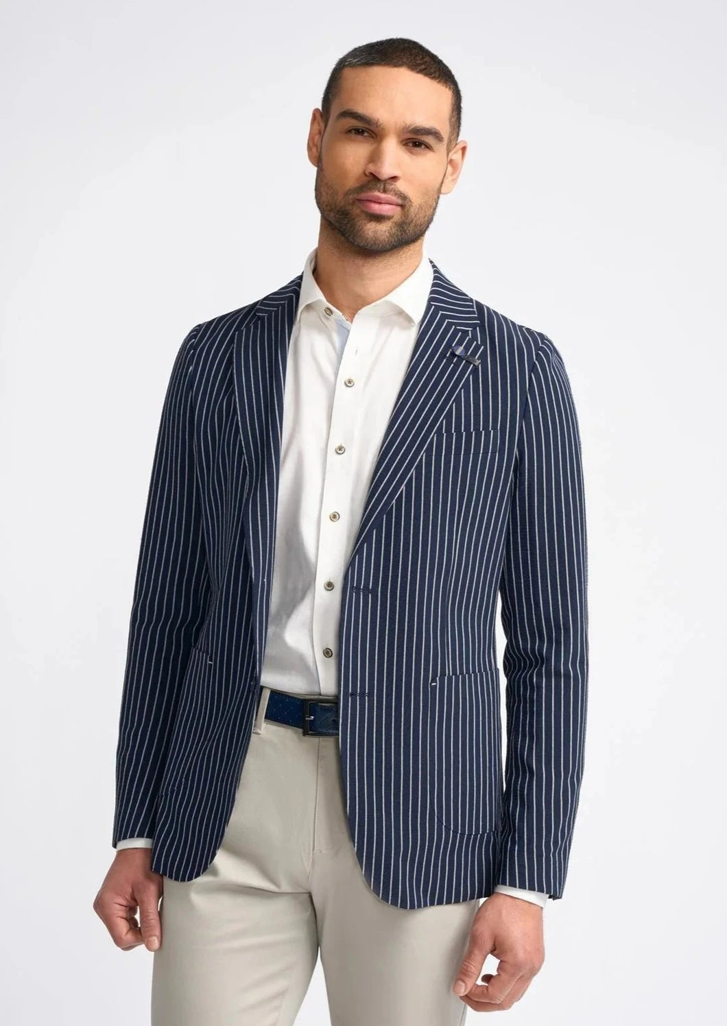 Striped blazer for men, worn by model.