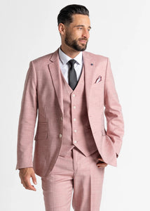 Model wearing Pastel Pink Edward Suit faces slightly away from camera. Closer up image of details of pink men's suit.