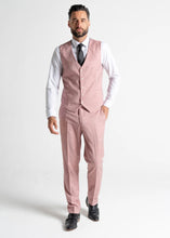 Load image into Gallery viewer, Model wearing the Edward Pastel Pink waistcoat and trousers directly faces the camera, showing the full Edward pastel pink outfit for men.
