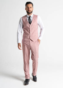 Model wearing the Edward Pastel Pink waistcoat and trousers directly faces the camera, showing the full Edward pastel pink outfit for men.