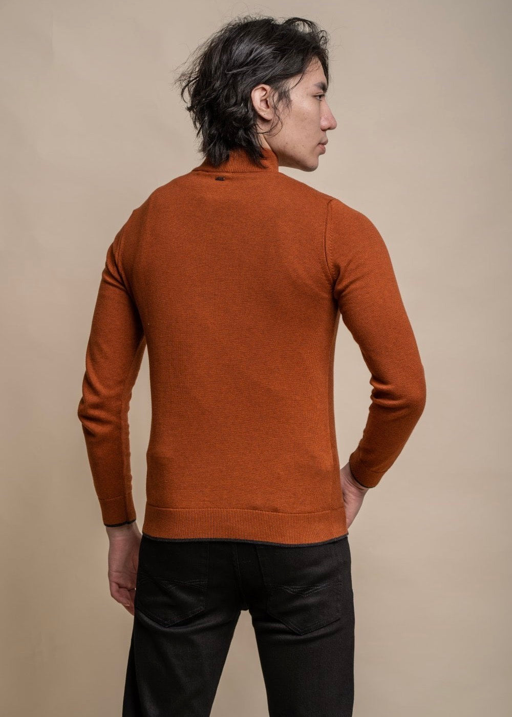 Half zip men's jumper in amber colour, showing reverse.