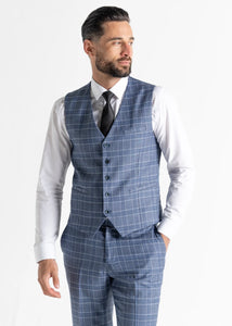 Model wearing Kensington Light-Blue Waistcoat and Trousers faces away from camera while showing front details.