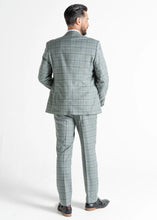 Load image into Gallery viewer, Model wearing Kensington Olive Suit has back to the camera, showing reverse details of suit. 
