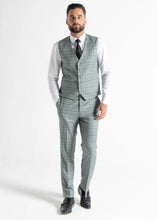 Load image into Gallery viewer, Model wearing Kensington Olive Waistcoat and Trousers faces camera, showing front details of waistcoat and trousers.

