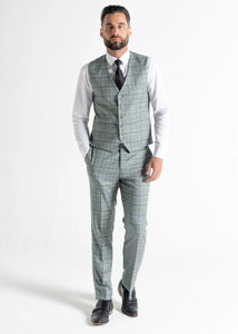 Model wearing Kensington Olive Waistcoat and Trousers faces camera, showing front details of waistcoat and trousers.