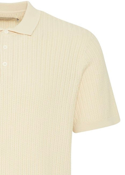 Men's polo shirt in cream knit, close up on details.