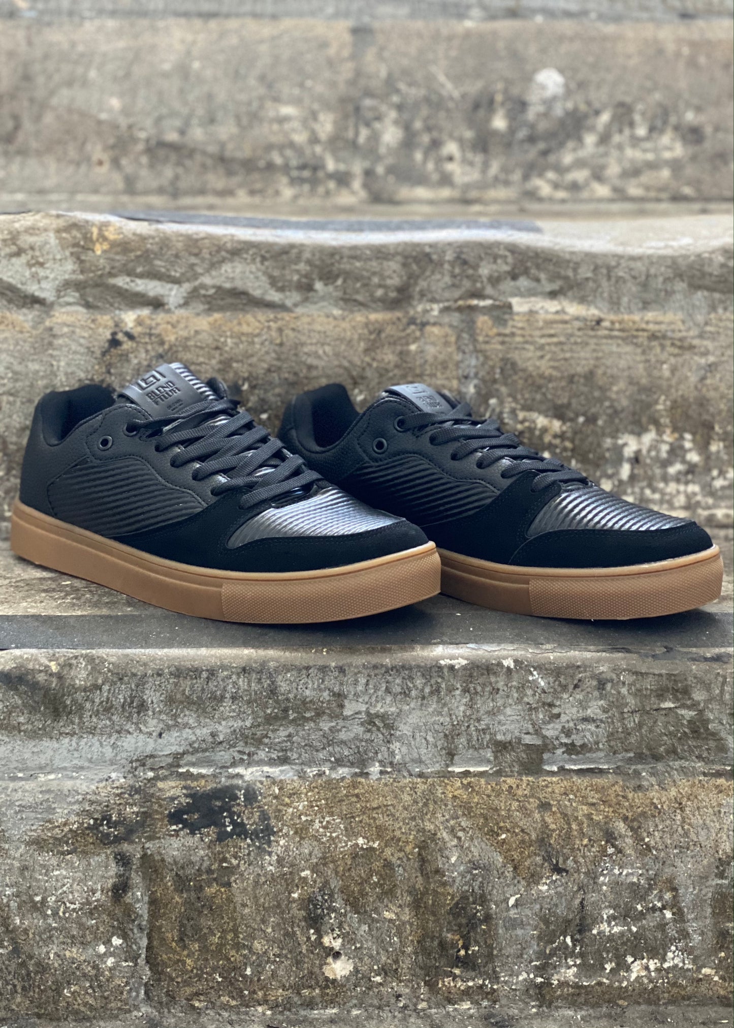 Casual Black trainers with brown sole. Comfortable footwear to wear with jeans, chinos or shorts in any season.