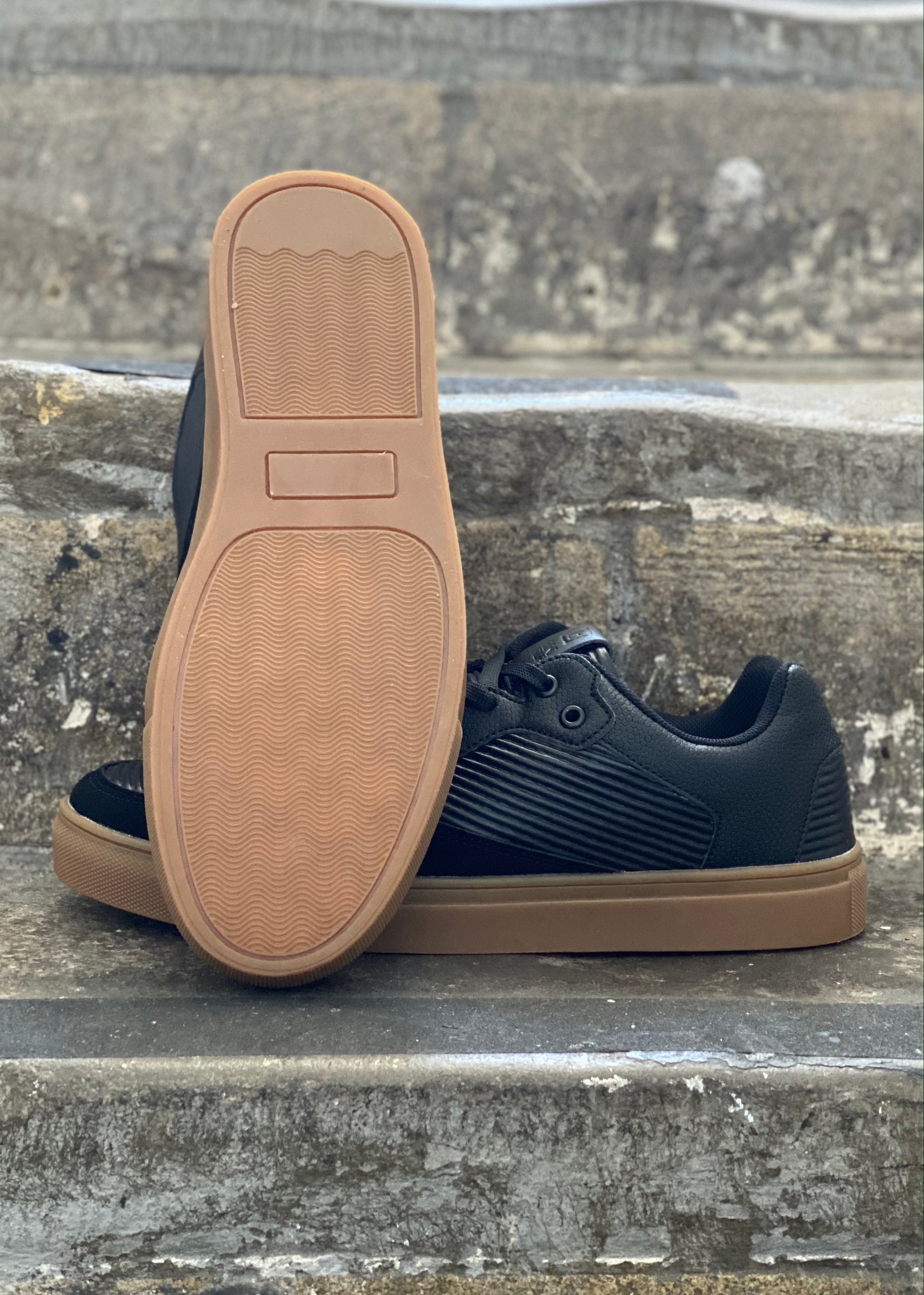 Casual Black trainers with brown sole. Comfortable footwear to wear with jeans, chinos or shorts in any season.