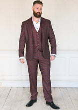 Load image into Gallery viewer, Cavani Carly Wine 3-Piece Suit consisting of jacket, trousers and waistcoat worn with a crisp white shirt and black shoes. Ideal for a wedding or another formal event or occasion.
