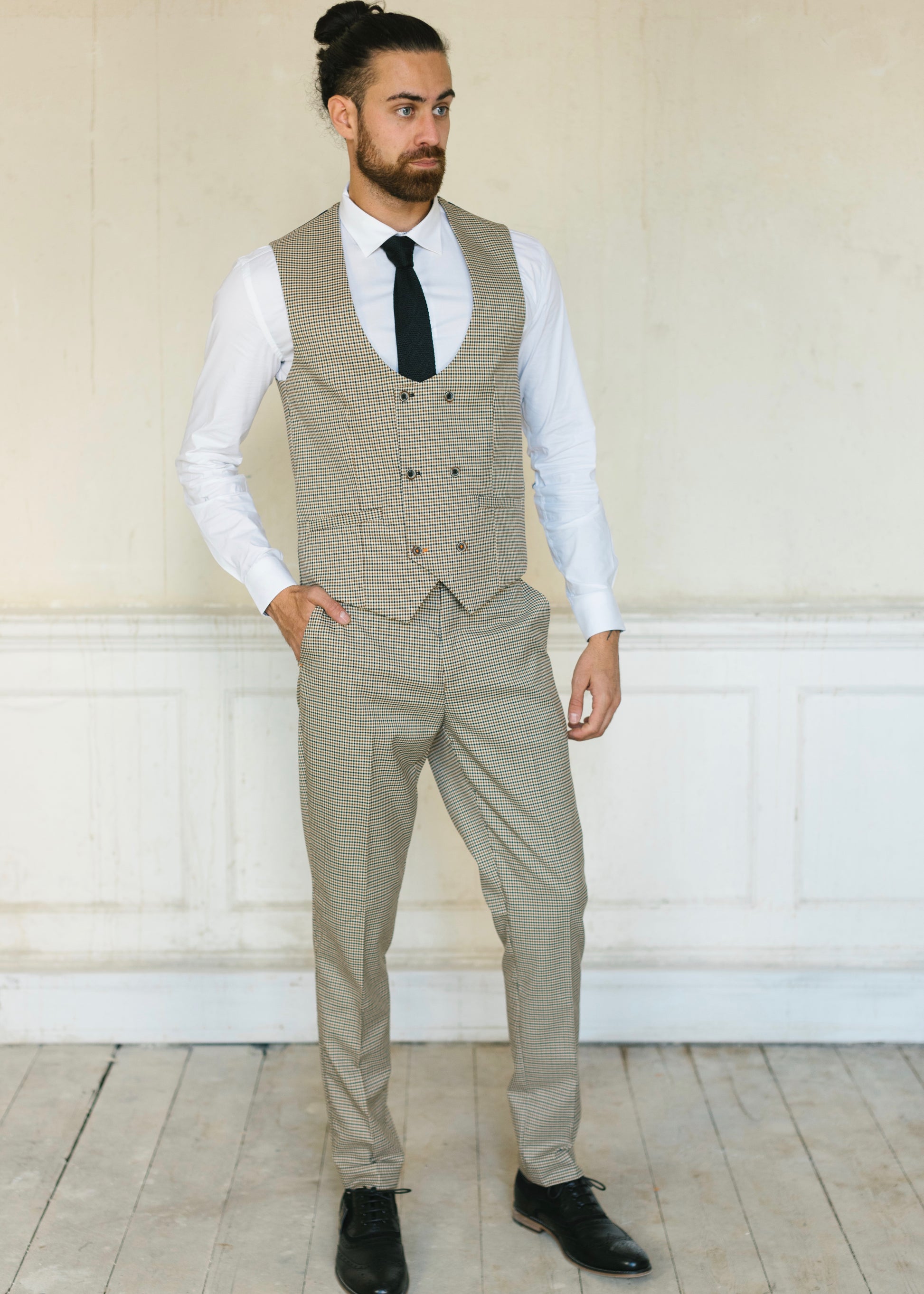 Cavani Elwood Houndstooth Checked Trousers with matching waistcoat worn with black shoes and a knit tie on a white Suave Owl crisp shirt