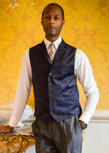 Load image into Gallery viewer, BAME model wearing Cavani Enna Waistcoat in a traditional formal setting. Paired with a white shirt, patterned tie
