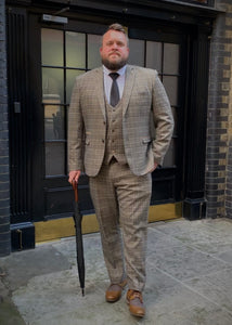 Marc Darcy Enzo Checked Waistcoat with matching jacket and trousers to complete a 3 piece suit. Worn with a white shirt, dark coloured tie and finished with a gentleman's black and brown umbrella in the city of Bath.