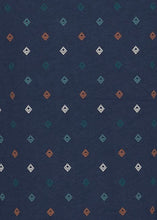 Load image into Gallery viewer, Navy T-shirt diamond pattern close up. The diamonds are in interweaving rows - each row is a different colour in a repeating sequence of ocean blue, stone blue, burnt orange and white.
