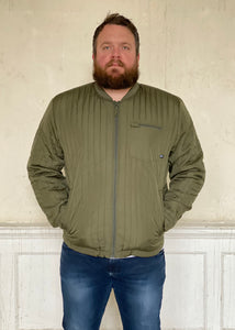 Lightweight quilted jacket.  Two external press stud fasten pockets & zipped chest pocket.