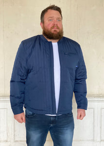 Quilted Jacket Petrol Blue worn with t shirt and jeans