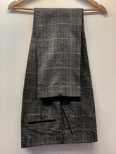 Load image into Gallery viewer, Marc Darcy Scott Grey Tweed Trousers hung up. Perfect menswear for office or formal attire
