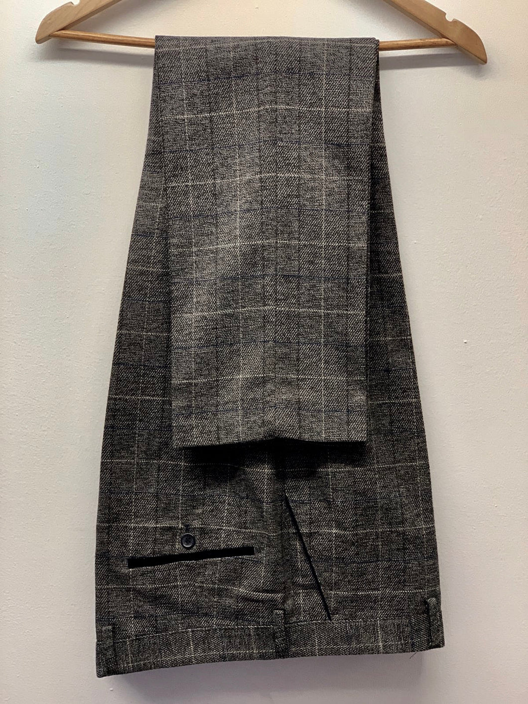 Marc Darcy Scott Grey Tweed Trousers hung up. Perfect menswear for office or formal attire