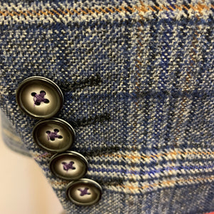 Focus on the buttons of a Robert Simon Marcello Blue Tweed Jacket