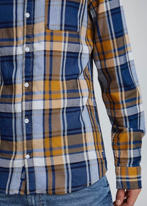 Lumberjack shirt butterscotch blue with orange butterscotch base tones with blue & navy checked detail. Close up of shirt on model.